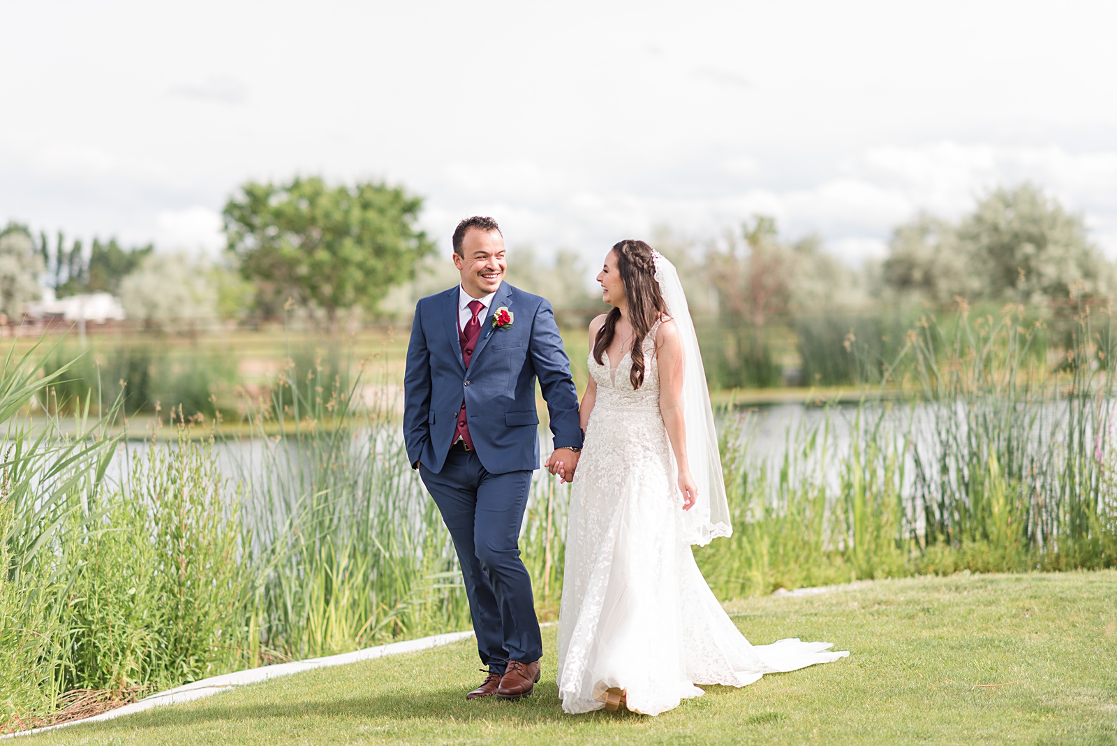 bride and groom at a creekside affair wedding