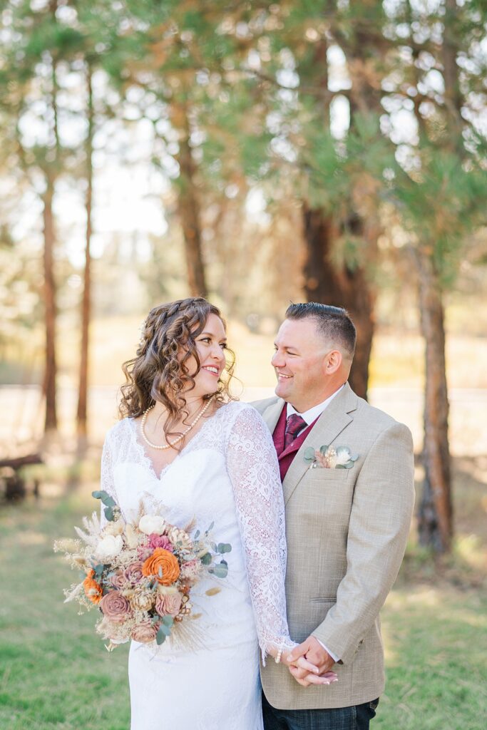 bride and groom wedding day portraits at riverside pines wedding venue