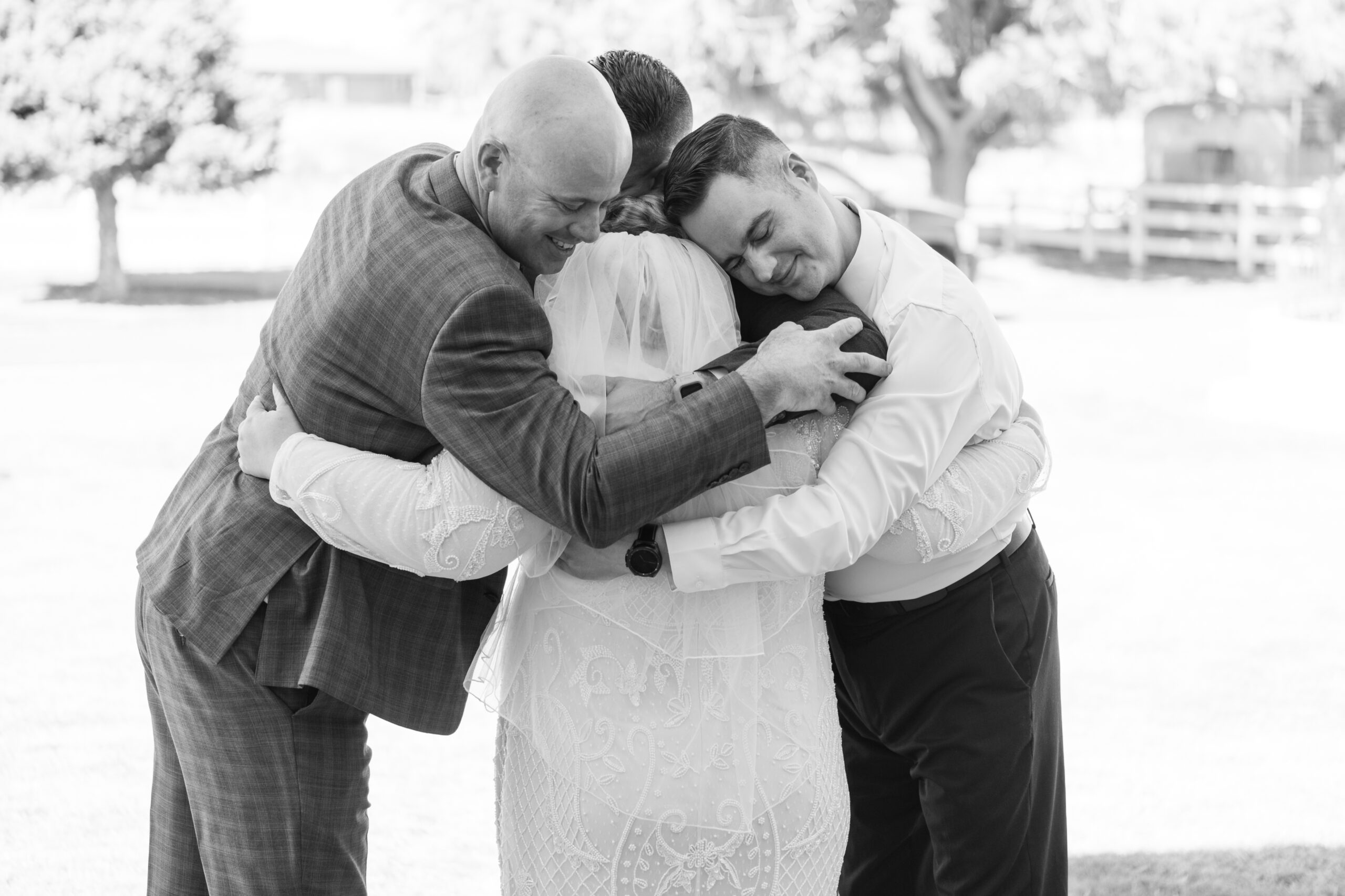 Family hug at a wedding